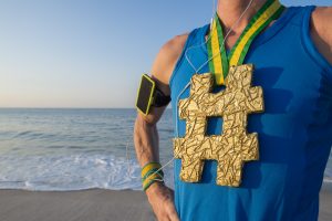 Runner with a hash tag medal